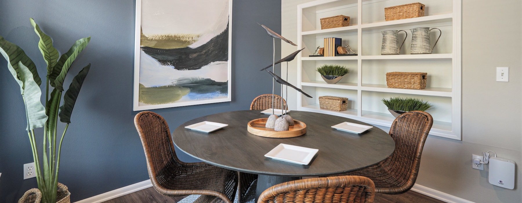 a room with a table and chairs