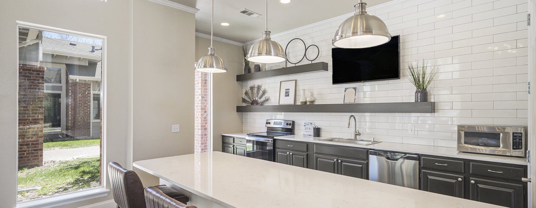 a kitchen with a table and chairs