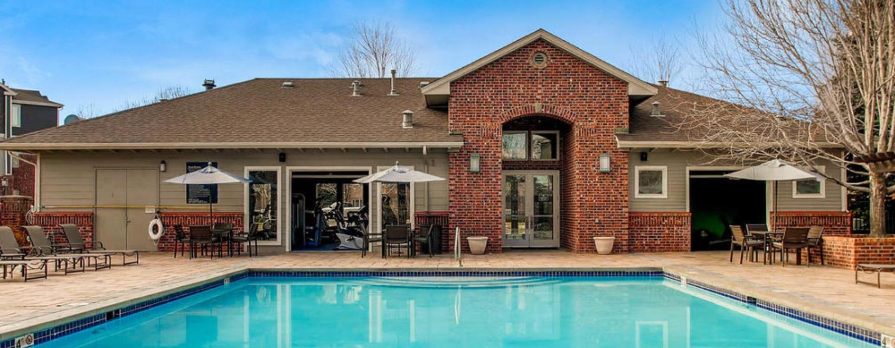 a swimming pool in front of a house